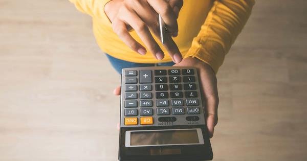 person using calculator to measure ROI for event